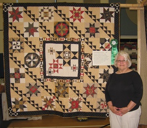 Barbara Stiner with her quilt "Star Medallion"